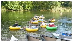 People floating in tubes