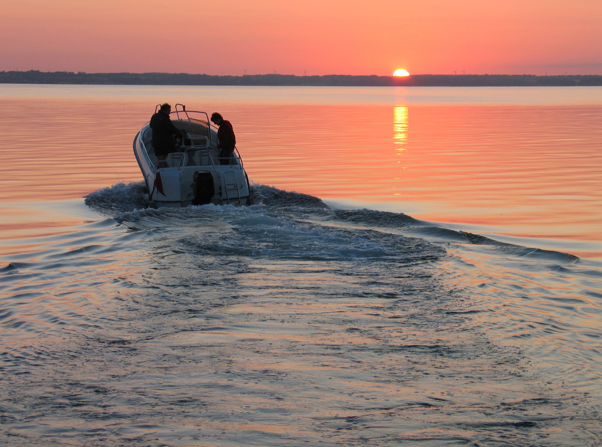 boating on lake at sunset