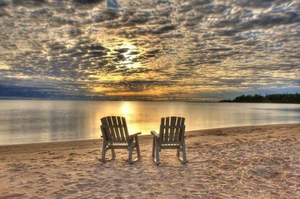 chair on beach at sunrise
