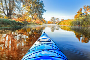 Kayak on river in fall