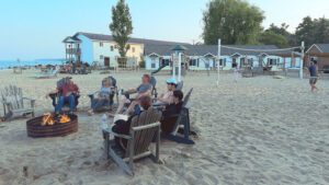 People enjoying a beach bonfire