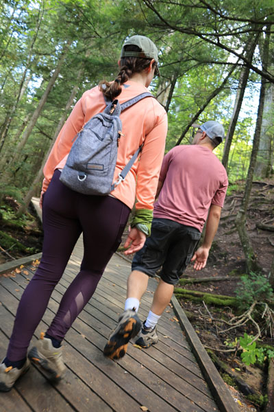 Couple walking on boardwalk trail