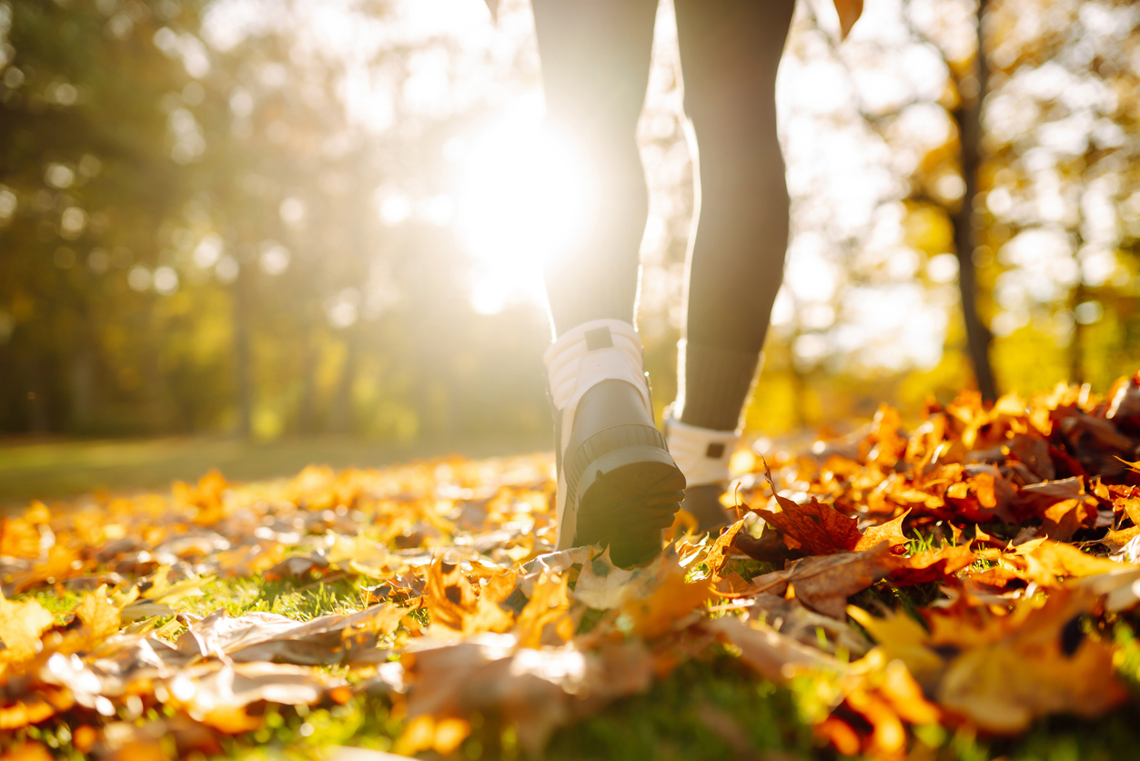 Girl walking on fall trail