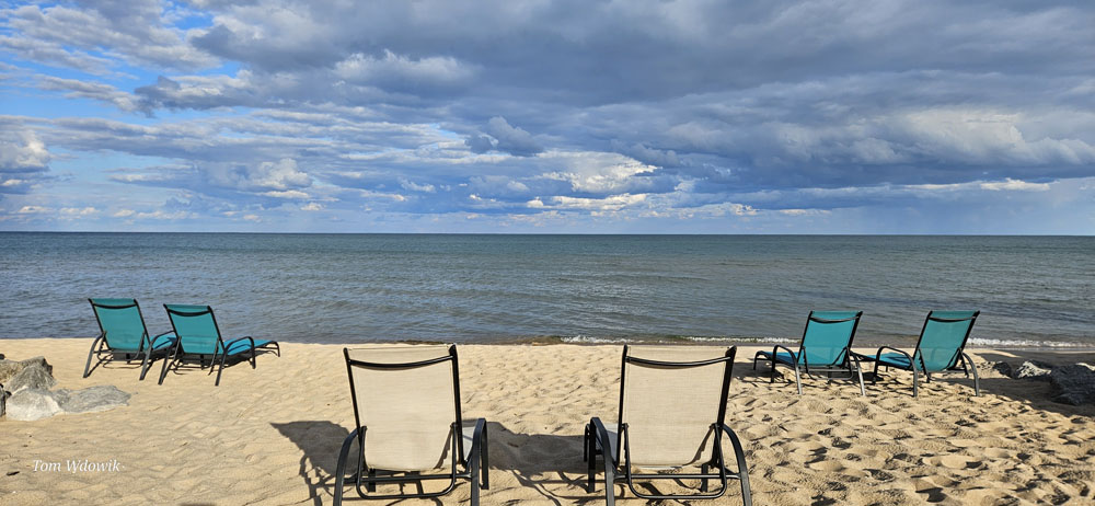 Beach chairs on beach on the shore of Lake Huron