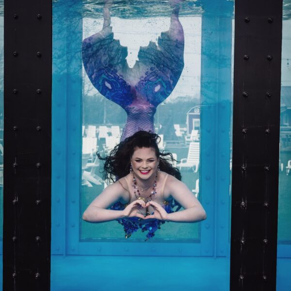 Mermaid swimming in tank